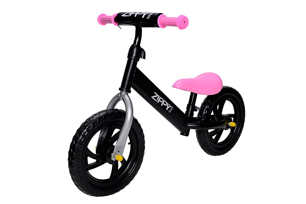 Bicicleta infantil de equilíbrio, sem pedais, rosa e preta.