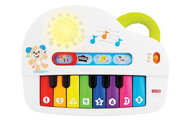 piano plástico de brinquedo, com luzes, desenhos, como o de um cachorro e teclas coloridas