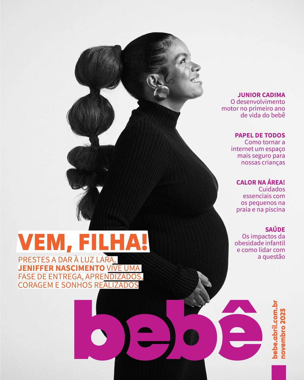 capa de revista com uma mulher grávida de lado, sorrindo e com as mãos na barriga