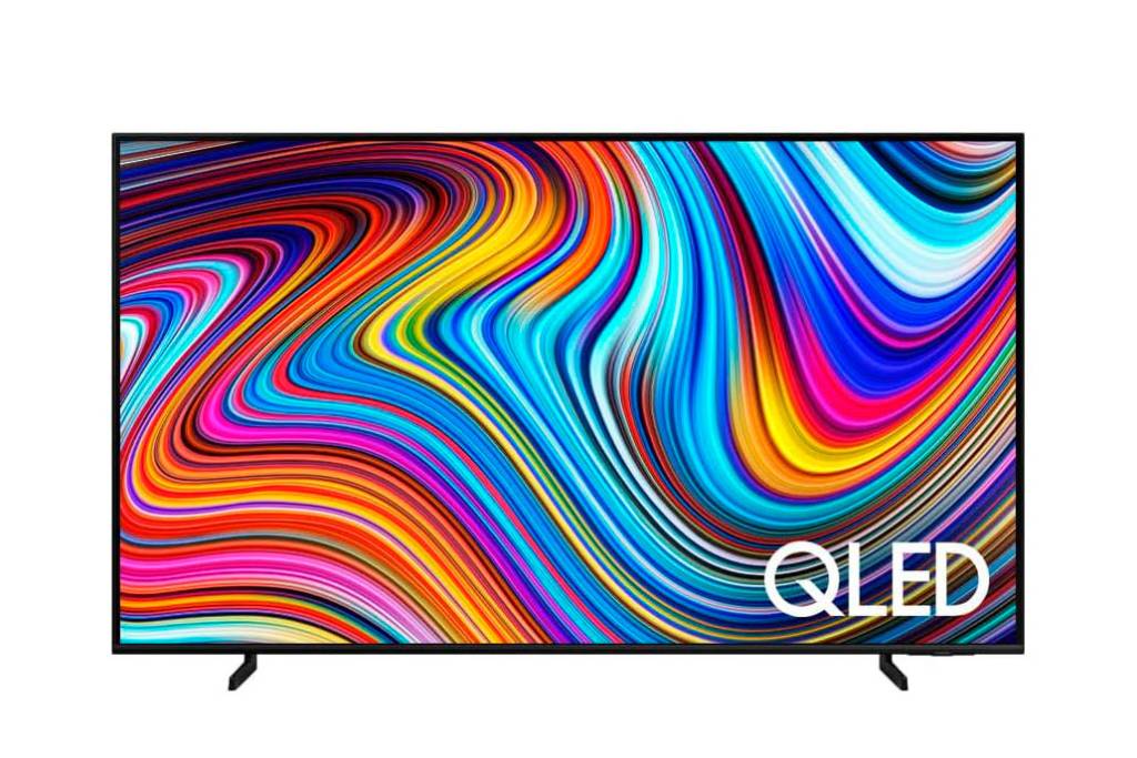 Sobre fundo branco, uma TV com ilustração toda colorida na tela. Tem dois pés de apoio.